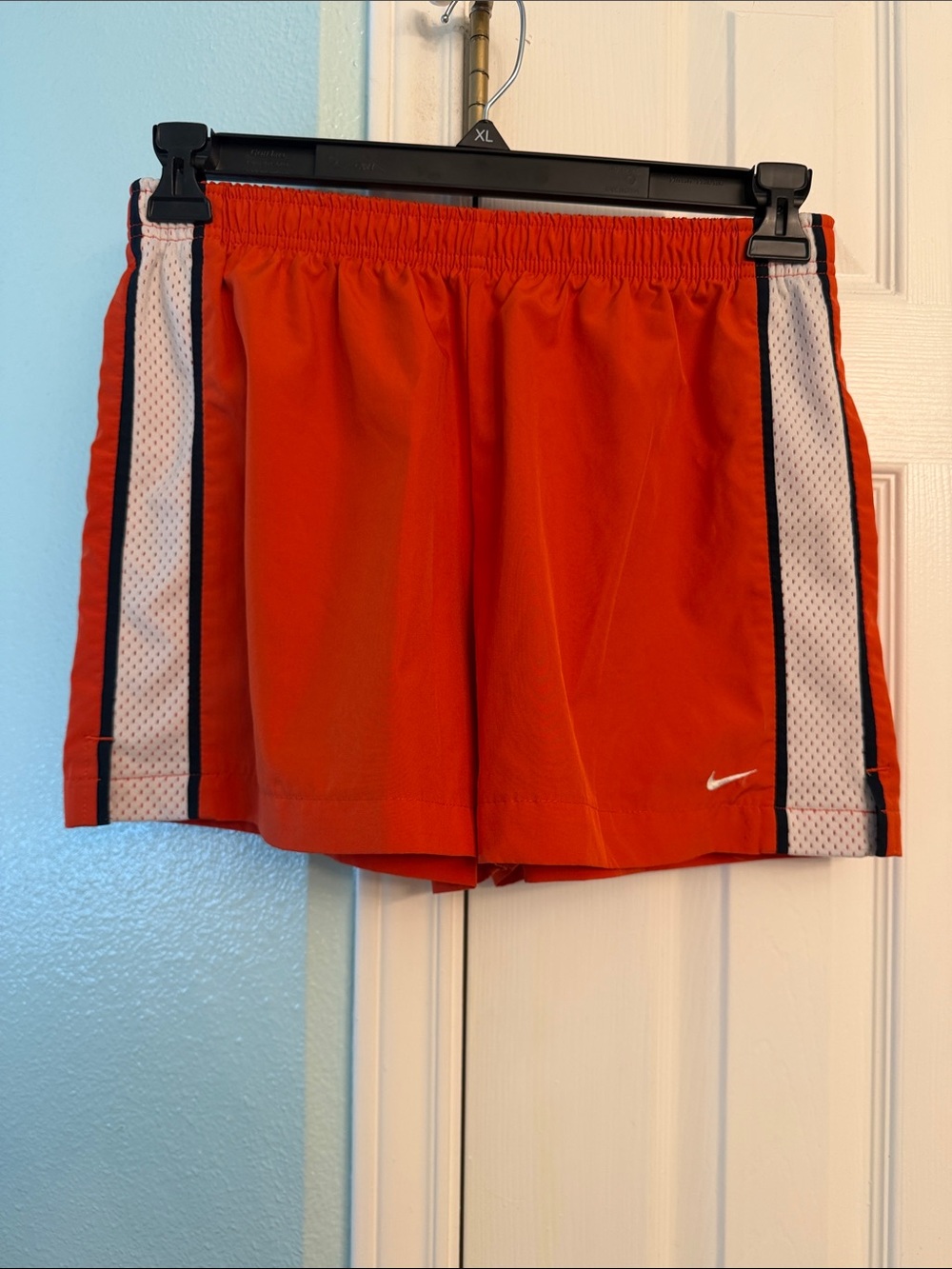 Nike Women's Orange Athletic Shorts with White Mesh Side Panels